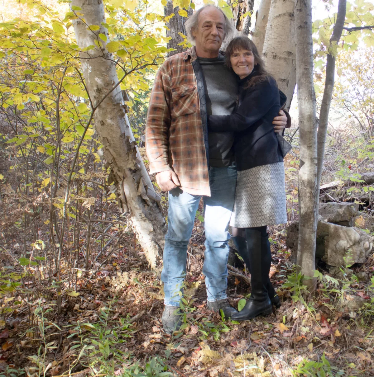 the seasonal farmer don and kirsten standing by a birch tree