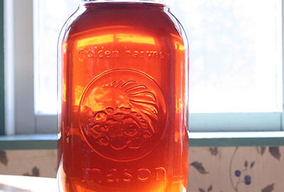 quart jar of maple syrup in the sun